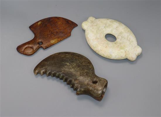 Two Chinese archaistic hardstone axe heads and an oval disc 19cm - 20cm